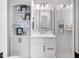 Bathroom with white cabinetry, granite counters, and a glass shower at 8258 Midnight Pass Rd, Sarasota, FL 34242