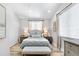 Light and airy bedroom featuring a cozy bed with soft linens and window with decorative drapes at 8258 Midnight Pass Rd, Sarasota, FL 34242