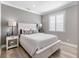 Modern bedroom with wood floors and neutral walls at 8258 Midnight Pass Rd, Sarasota, FL 34242