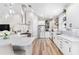 Bright kitchen with stainless steel appliances, marble countertops, and an island with a breakfast bar at 8258 Midnight Pass Rd, Sarasota, FL 34242