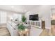Inviting living room features a comfortable sectional, media center, and stylish decor and bright natural light at 8258 Midnight Pass Rd, Sarasota, FL 34242