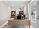 Bright office space features a desk, bookshelves, and exterior spiral staircase at 8258 Midnight Pass Rd, Sarasota, FL 34242