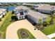 Aerial view of a two-story home showcasing the paver driveway, and landscaping around the property at 8265 Pavia Way, Bradenton, FL 34202