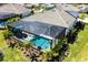 Gorgeous aerial view of homes with screened pools, offering a luxurious waterfront lifestyle at 8265 Pavia Way, Bradenton, FL 34202