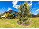 Beautifully landscaped backyard with a private pool and screened lanai, perfect for outdoor living at 8265 Pavia Way, Bradenton, FL 34202