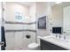 Modern bathroom featuring a glass shower, toilet, and vanity with a marble countertop at 8265 Pavia Way, Bradenton, FL 34202