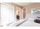 Bedroom featuring light-colored walls and access to an ensuite bathroom at 8265 Pavia Way, Bradenton, FL 34202