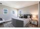 Serene bedroom with a plush gray bed, stylish nightstands, and soft lighting, offering a relaxing retreat at 8265 Pavia Way, Bradenton, FL 34202