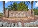 Community entrance fountain with a stone facade bearing the name 'The Lake Club' at 8265 Pavia Way, Bradenton, FL 34202