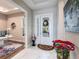 Bright foyer with marble floors, a decorative vase, and an open view to the office at 8265 Pavia Way, Bradenton, FL 34202