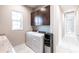 Convenient laundry room features sleek washer, dryer, and cabinet storage at 8265 Pavia Way, Bradenton, FL 34202