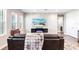 Cozy living room with a comfortable sofa, a TV, and large windows offering natural light at 8265 Pavia Way, Bradenton, FL 34202