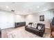 Spacious living room featuring a sofa, bar area with sink, and ample seating for relaxation and entertainment at 8265 Pavia Way, Bradenton, FL 34202