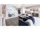 An open concept featuring the living room with a staircase and an adjacent kitchen with a breakfast bar at 8265 Pavia Way, Bradenton, FL 34202