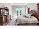 Spacious main bedroom features a decorative bed frame and tranquil views at 8265 Pavia Way, Bradenton, FL 34202