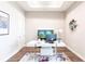 Modern office featuring a sleek desk, aquarium, and artwork at 8265 Pavia Way, Bradenton, FL 34202