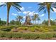 Community park with a decorative water fountain and manicured landscape, framed by palm trees at 8265 Pavia Way, Bradenton, FL 34202