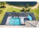 Aerial view of the private pool, spa, and screened-in lanai by the lake at 8265 Pavia Way, Bradenton, FL 34202