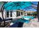 Enjoy the spa and lake view in your beautiful screened-in pool area at 8265 Pavia Way, Bradenton, FL 34202