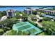 Beautiful aerial view of waterfront condos, and tennis courts at the Turtle Bay community in Siesta Key, Florida at 8735 Midnight Pass Rd # 301B, Sarasota, FL 34242