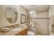 Bathroom boasts a granite countertop sink and a glass-enclosed shower at 8735 Midnight Pass Rd # 301B, Sarasota, FL 34242