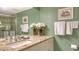 Inviting bathroom with granite countertops, ornate mirrors and shelving offer a refreshing and elegant space at 8735 Midnight Pass Rd # 301B, Sarasota, FL 34242