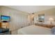 Comfortable bedroom features ample closet space and a classic dresser at 8735 Midnight Pass Rd # 301B, Sarasota, FL 34242