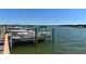 View of the boat dock at the Turtle Bay community, with boats moored along the dock at 8735 Midnight Pass Rd # 301B, Sarasota, FL 34242