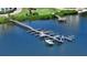 Aerial view of boat docks with multiple boats moored at the Turtle Bay community, Siesta Key, Florida at 8735 Midnight Pass Rd # 301B, Sarasota, FL 34242