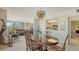Dining room with pass-through to the kitchen and comfortable seating at 8735 Midnight Pass Rd # 301B, Sarasota, FL 34242