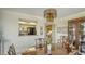 Dining room with built-in display cabinet and pass-through to the kitchen at 8735 Midnight Pass Rd # 301B, Sarasota, FL 34242