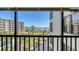 Scenic waterfront view from balcony featuring lush green landscape and clear skies at 8735 Midnight Pass Rd # 301B, Sarasota, FL 34242