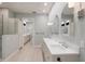 Spacious bathroom showcasing double sink vanity, shower, and separate toilet room at 875 Siesta Key Cir, Sarasota, FL 34242