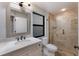Bathroom featuring marble countertop vanity, glass shower and modern fixtures at 875 Siesta Key Cir, Sarasota, FL 34242