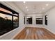Spacious bedroom with multiple windows offering panoramic views of the waterfront at 875 Siesta Key Cir, Sarasota, FL 34242
