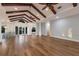 Inviting living room showcases hardwood floors, beamed ceilings, and an open layout, perfect for entertaining at 875 Siesta Key Cir, Sarasota, FL 34242