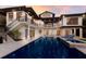 A stunning view of the pool area, perfect for relaxing and entertaining with resort-style seating and lush landscaping at 875 Siesta Key Cir, Sarasota, FL 34242