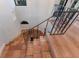 Elegant staircase with decorative iron railing and terracotta tile steps at 875 Siesta Key Cir, Sarasota, FL 34242