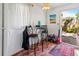 Charming dining area with natural light, tile flooring, and view of backyard at 919 N Osprey Ave, Sarasota, FL 34236