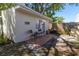 Cozy patio featuring brick pavers and an outdoor seating area, surrounded by lush greenery at 919 N Osprey Ave, Sarasota, FL 34236