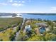 An aerial shot of this waterfront home and surrounding foliage with access to the beautiful bay at 109 Michiana Dr, Terra Ceia, FL 34250