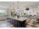 Spacious clubhouse with modern furnishings, a large island, and ample seating for gatherings at 11200 Mcdermott Ct, Englewood, FL 34223