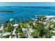 Stunning aerial view showcasing the property's beautiful pool, lush landscaping, and convenient marina access at 12204 45Th Avenue W Dr, Cortez, FL 34215