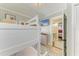 Bedroom featuring bunk beds, a TV and ensuite bathroom at 12204 45Th Avenue W Dr, Cortez, FL 34215