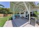 Outdoor patio with comfortable seating, an outdoor grill, and lovely views of the surrounding landscape at 12204 45Th Avenue W Dr, Cortez, FL 34215