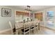 Dining room with a wooden table, seating for eight, and natural light at 12204 45Th Avenue W Dr, Cortez, FL 34215