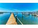 Scenic view of the waterfront from a wooden dock, showcasing the beautiful boats and piers in the harbor at 12204 45Th Avenue W Dr, Cortez, FL 34215