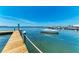 Waterfront dock featuring boats and piers, offering a stunning view of the peaceful blue sea at 12204 45Th Avenue W Dr, Cortez, FL 34215