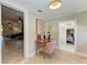 Bright hallway with herringbone floors, a charming desk nook, and open doorways to other rooms at 12204 45Th Avenue W Dr, Cortez, FL 34215