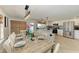 Open kitchen and dining area with herringbone floors, perfect for Gathering gatherings at 12204 45Th Avenue W Dr, Cortez, FL 34215